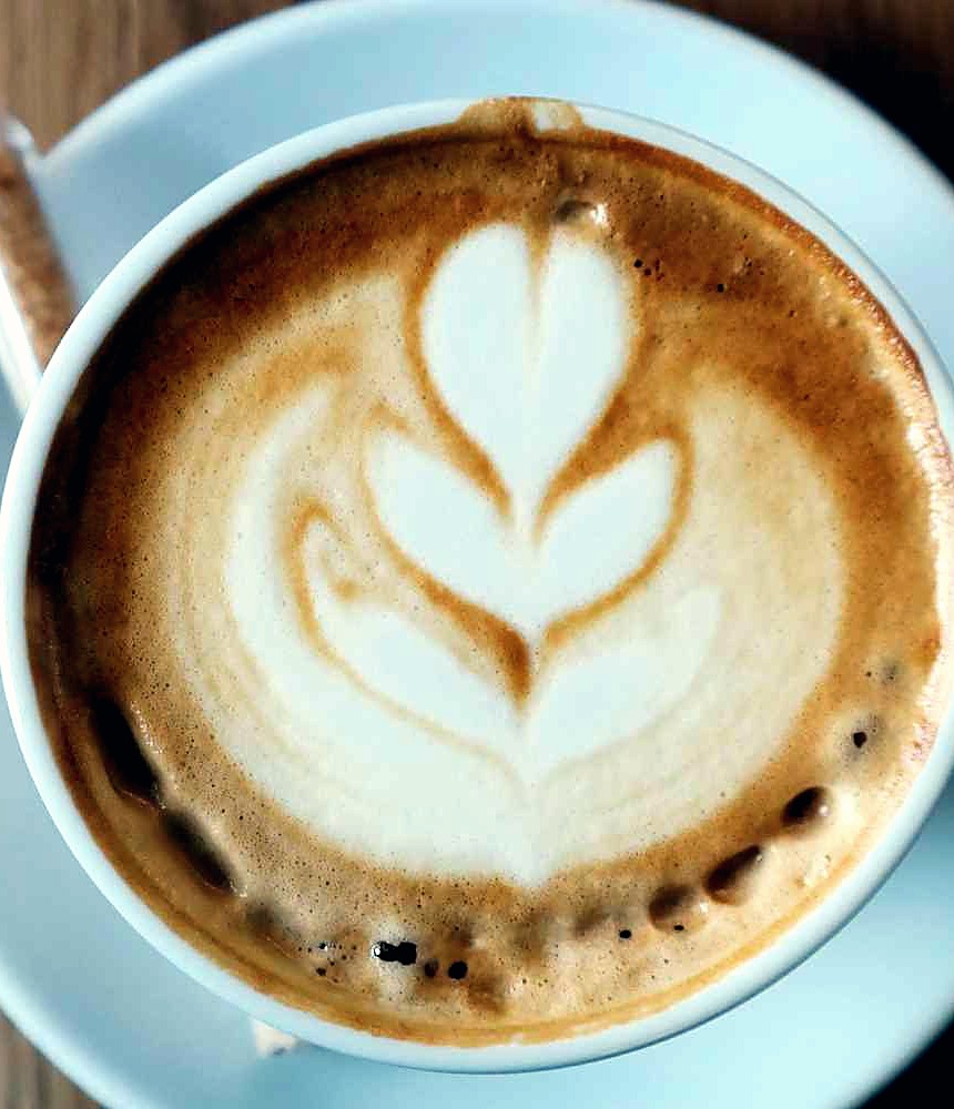 A latte with leaf-pattern art, the kind of short break perfect for a quick quiz